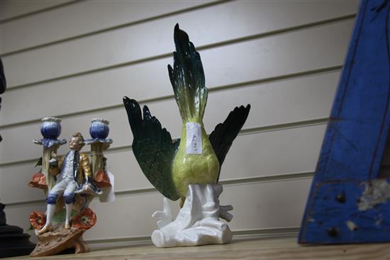 A Continental porcelain parrot and a two branch figural candelabrum